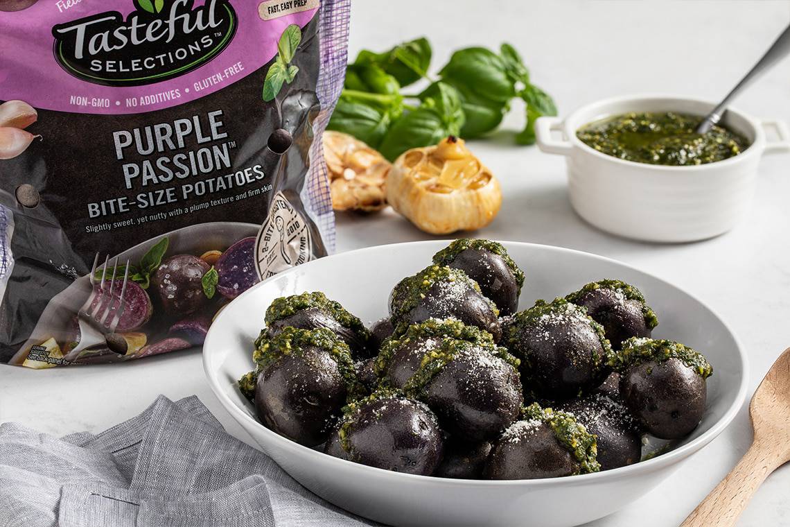 Tasteful Selections recipe for Steamed Purple Passion Potatoes with Roasted Garlic and Pesto made with small potatoes