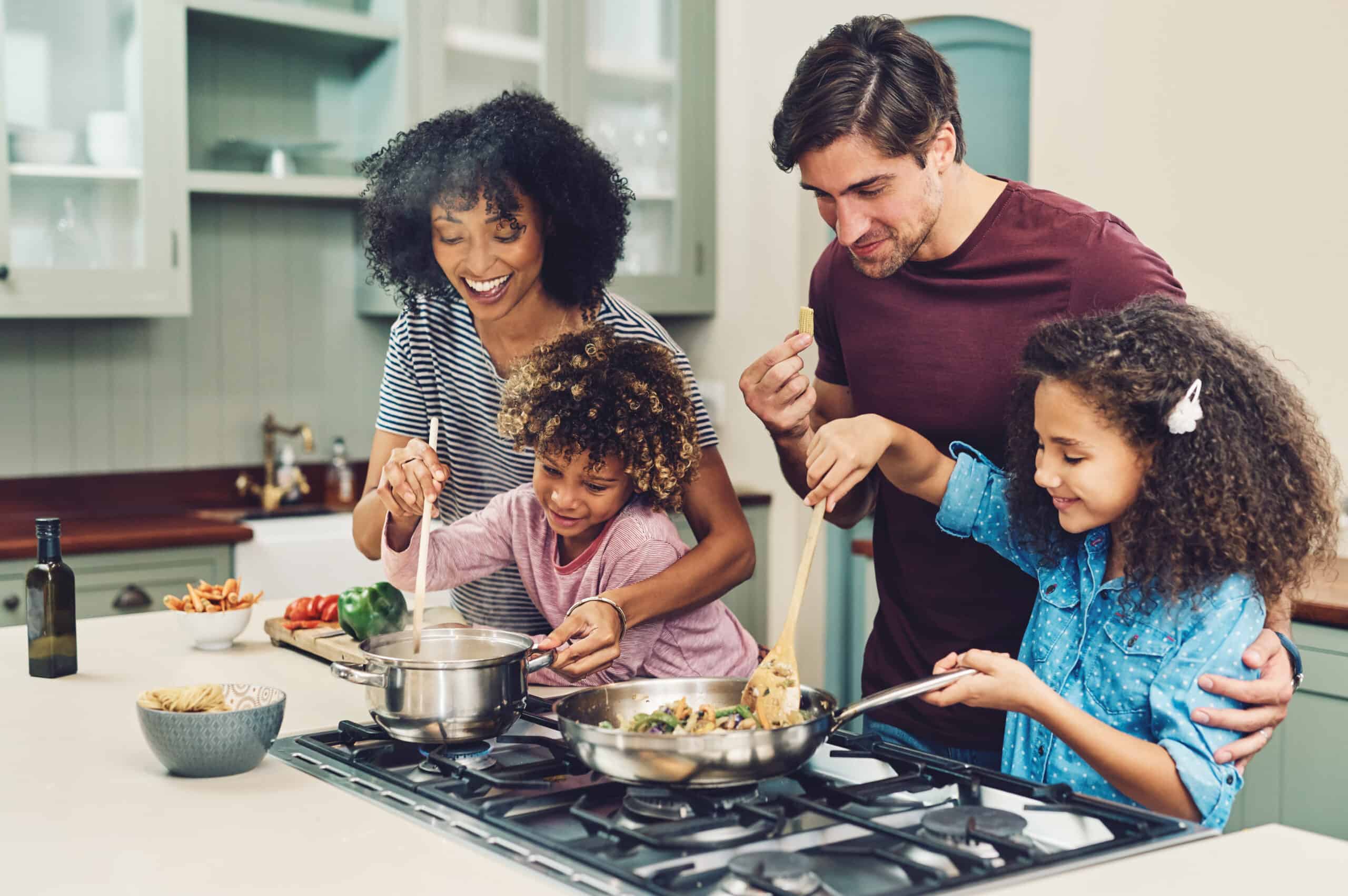 Family cooking together in kitchen