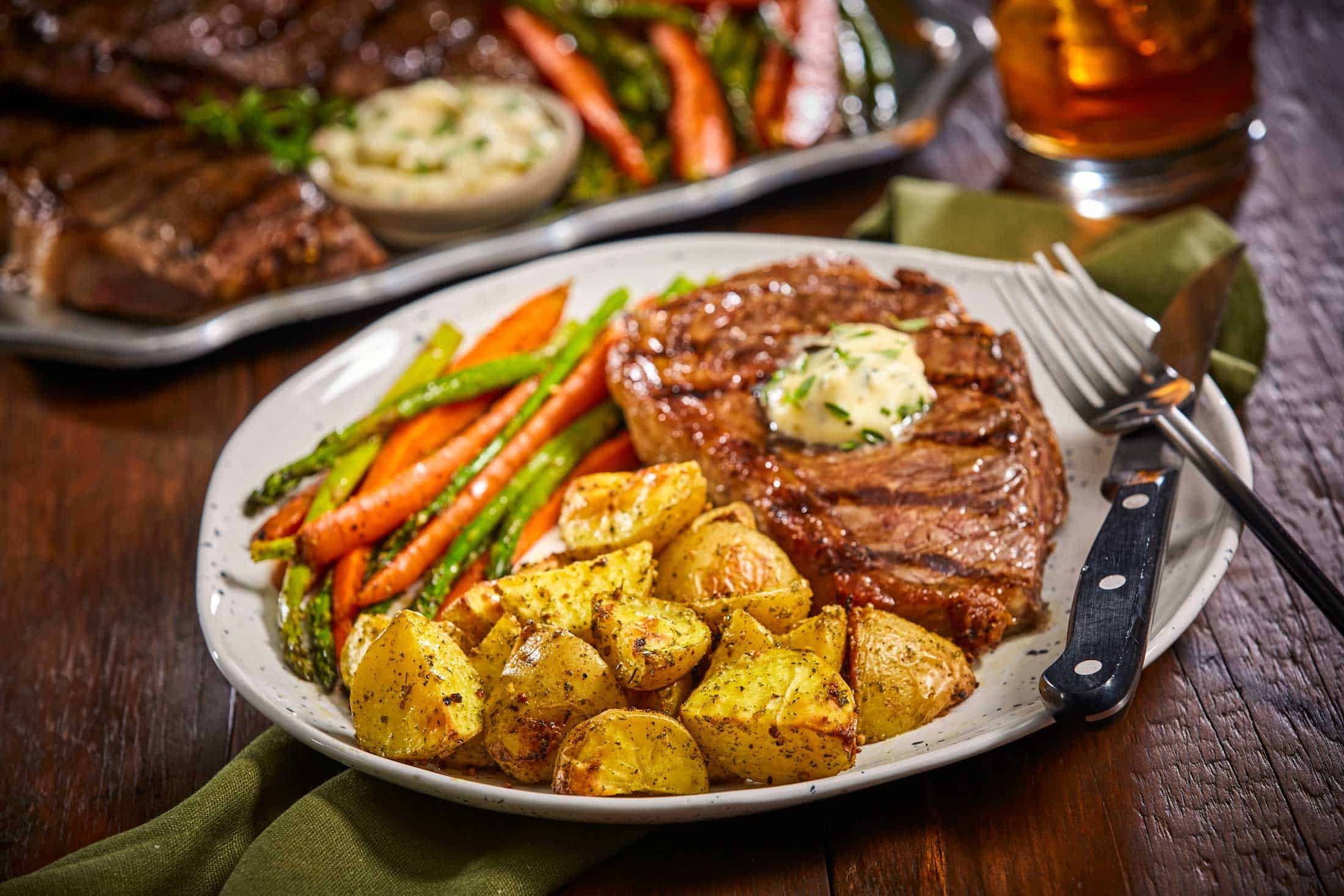 Grilled Steak with Herb Butter with Garlic Parsley Potatoes