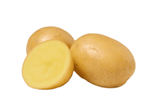 Whole and halved yellow potatoes on white background